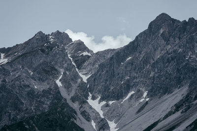 Scenic view of snow covered mountains against sky