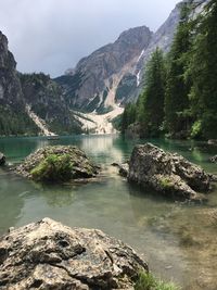 Scenic view of lake and mountains against sky