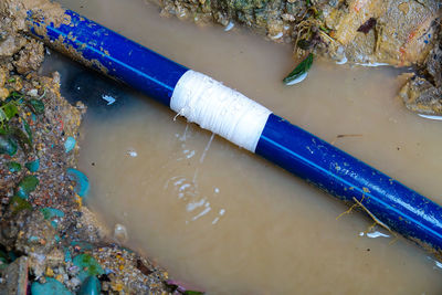 High angle view of plastic container on shore