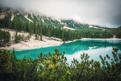 Scenic view of lake and mountains against sky