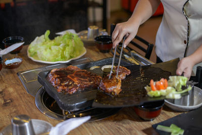 Man preparing food on table