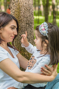 Girl with mother at park