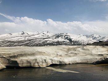 Scenic view of snowcapped mountains against sky