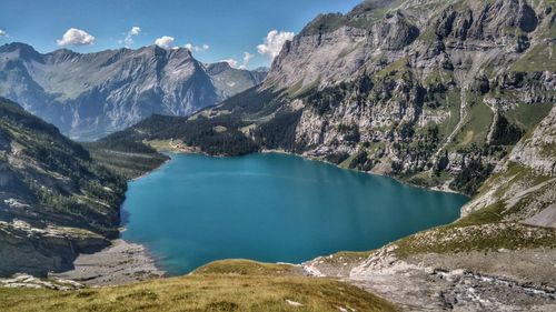 Scenic view of lake and mountains against sky