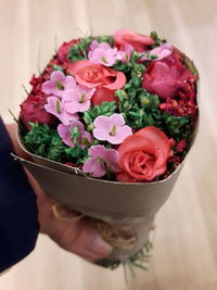 Close-up of hand holding bouquet