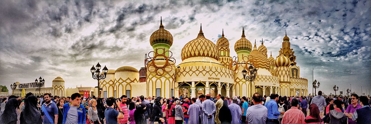 architecture, built structure, building exterior, religion, sky, place of worship, spirituality, cloud - sky, cloudy, person, famous place, travel destinations, cloud, large group of people, tourism, men, church, temple - building