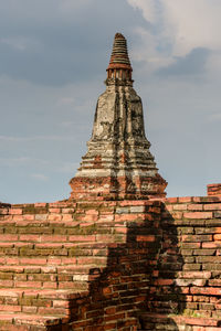 Low angle view of old building in ayutthaya province under the blue sky