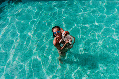 High angle view of man swimming in pool