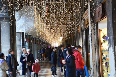 People in illuminated room