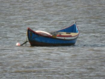 Boat moored in water