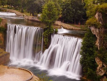 Scenic view of waterfall in forest