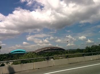 View of bridge against cloudy sky