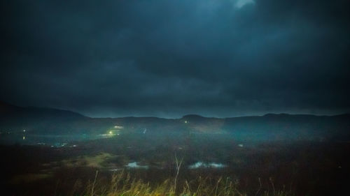Scenic view of mountain against cloudy sky