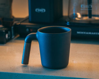 Close-up of coffee cup on table at home