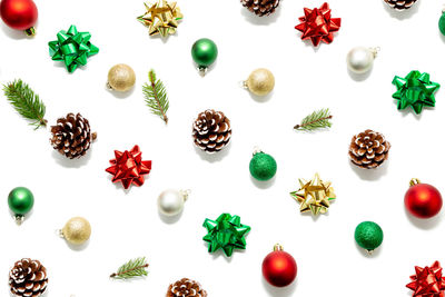 High angle view of christmas decorations over white background