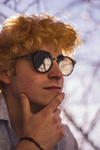 Close-up of young man wearing sunglasses