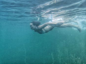 Woman diving in sea