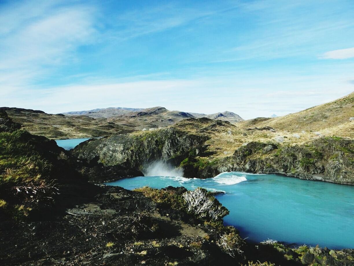 water, mountain, scenics, beauty in nature, tranquil scene, tranquility, sky, nature, blue, lake, tree, mountain range, river, idyllic, cloud - sky, non-urban scene, landscape, cloud, day, rock - object