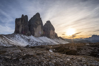 Rock formations on landscape against sky