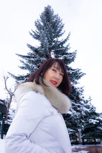 Portrait of smiling young woman in winter