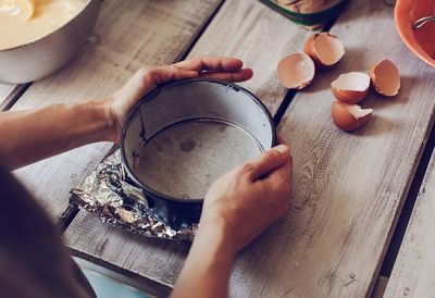 High angle view of man preparing food on table