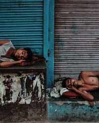 Portrait of young woman lying on floor