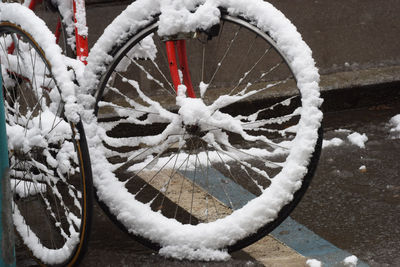 Close-up of snow covered bicycle