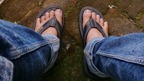 Low section of man and woman wearing shoes
