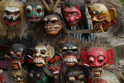 Demon masks on display at market stall