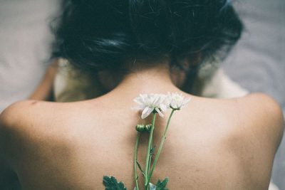 Close-up of woman holding flower bouquet