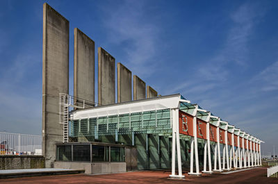 Entrance building of the benelux tunnel for cyclists and pedestrians under a blue sky