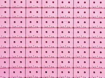 Full frame shot of pink audio cassettes