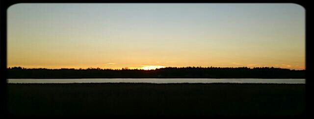 Scenic view of landscape at sunset