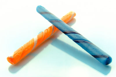 Close-up of colored pencils against white background