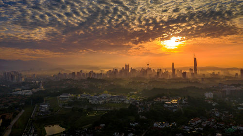 High angle view of townscape against sky during sunset