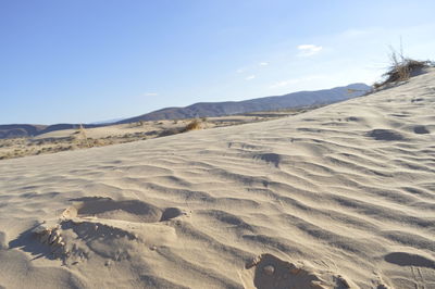 Scenic view of desert against sky