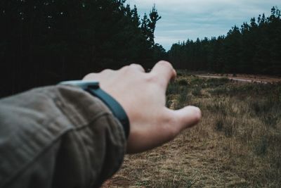 Cropped image of person standing on grass