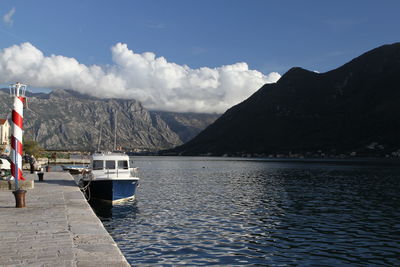 Scenic view of sea and mountains against sky