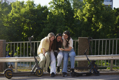 Group of young female friends spending time together outdoors