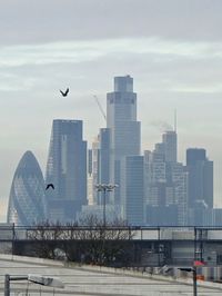 Modern buildings in city against sky