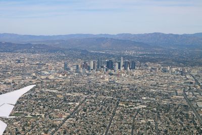 Aerial view of cityscape against sky
