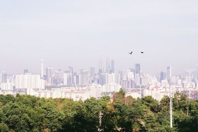 View of city buildings against sky