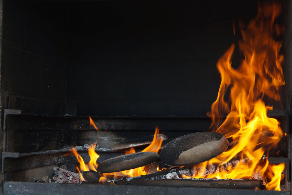 CLOSE-UP OF BONFIRE ON BARBECUE