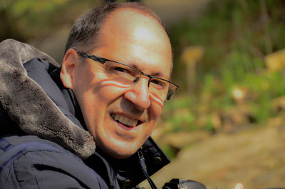 Portrait of happy mature man wearing eyeglasses