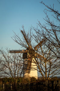 Traditional windmill against sky