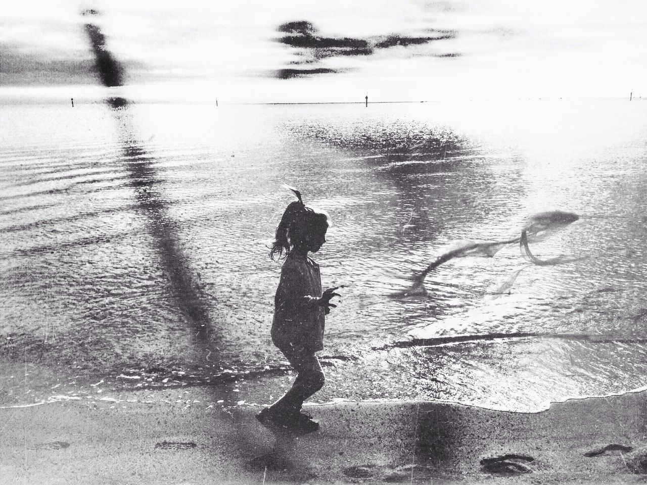 water, lifestyles, full length, walking, leisure activity, rear view, men, standing, silhouette, reflection, person, shadow, outdoors, day, puddle, bird, street, high angle view