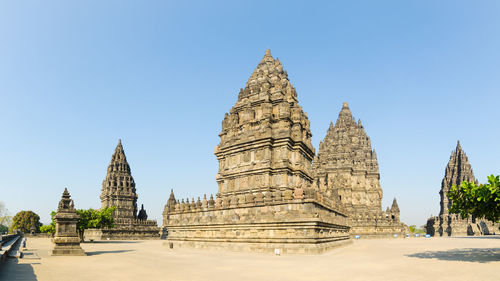 Panoramic view of temple against clear blue sky