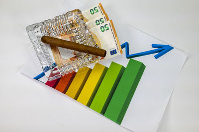 High angle view of colored pencils on white table