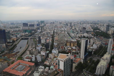 High angle view of modern buildings in city against sky