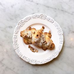 High angle view of cookies in plate on table